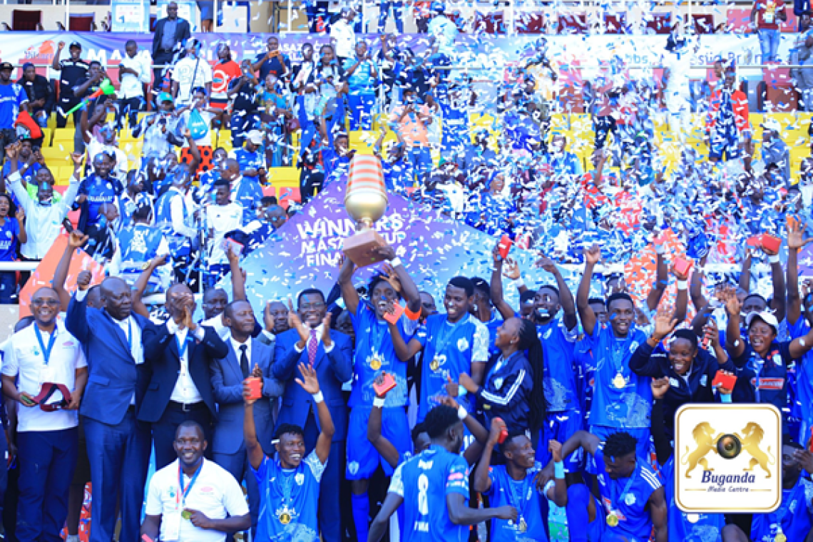 Buddu celebrates victory as they lift the 2024 Masaza Cup trophy Image
